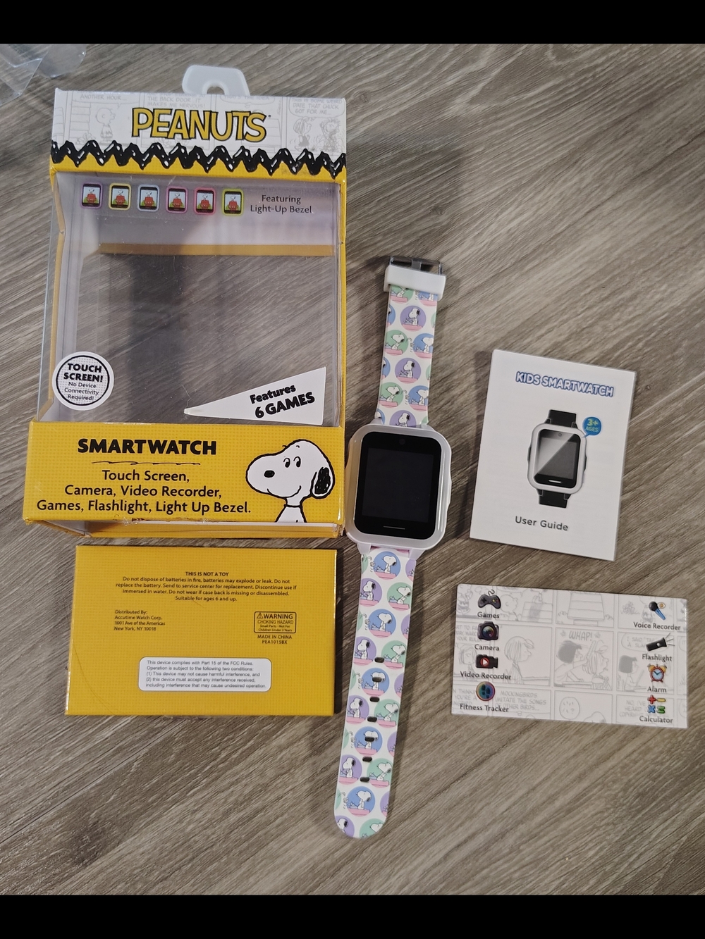 Peanuts Kids Smartwatch with White Case and Pastel Cartoon Strap